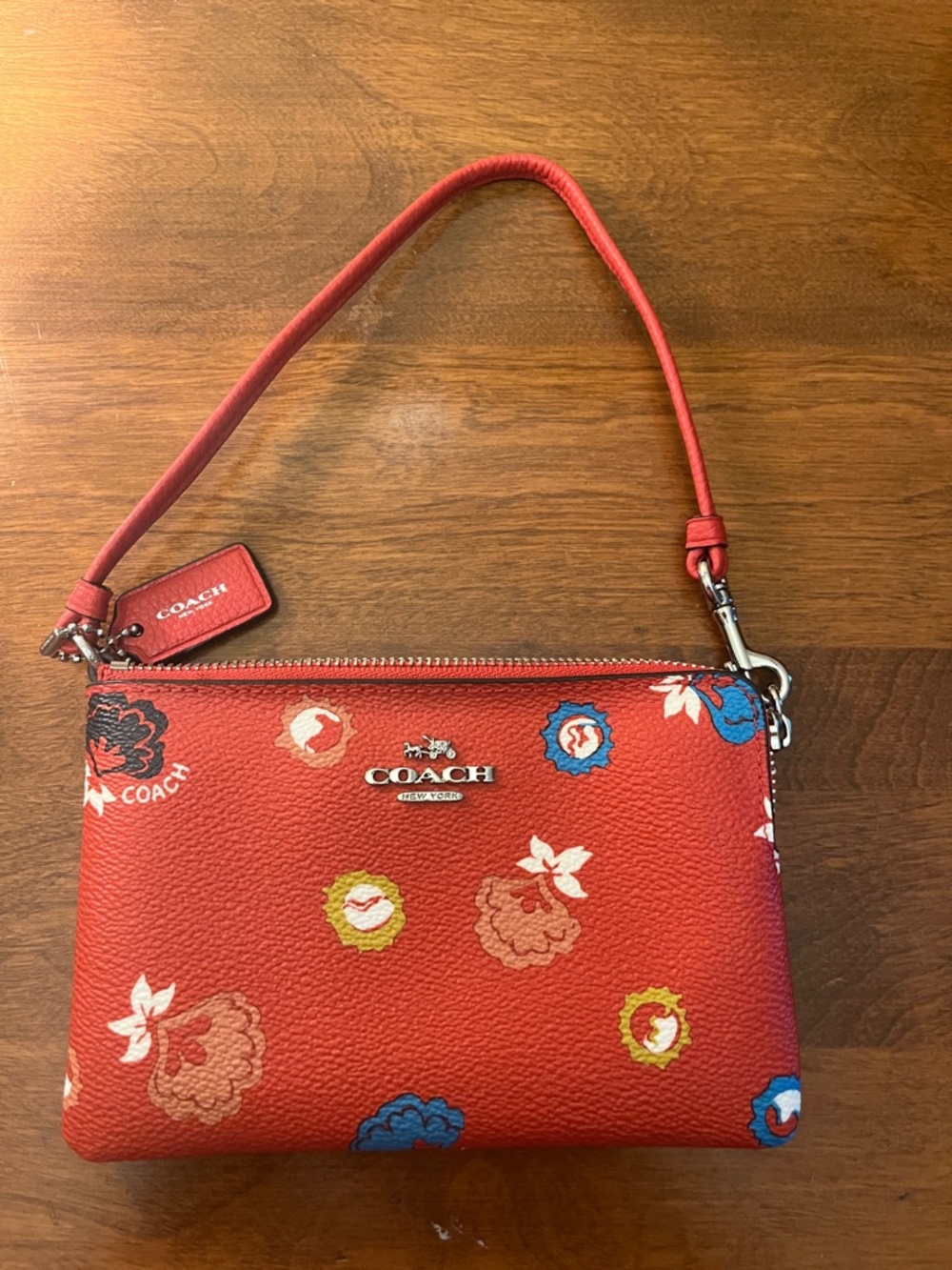 COACH Prairie Print Leather Wristlet Orange with Blue & Yellow Accents